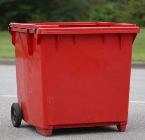 Red dumpster bin for event trash removal